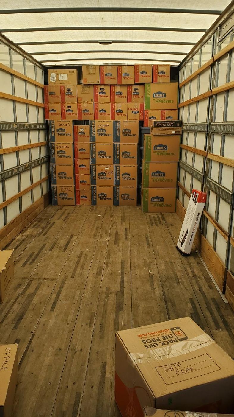 Box truck packed floor to ceiling with stacked boxes